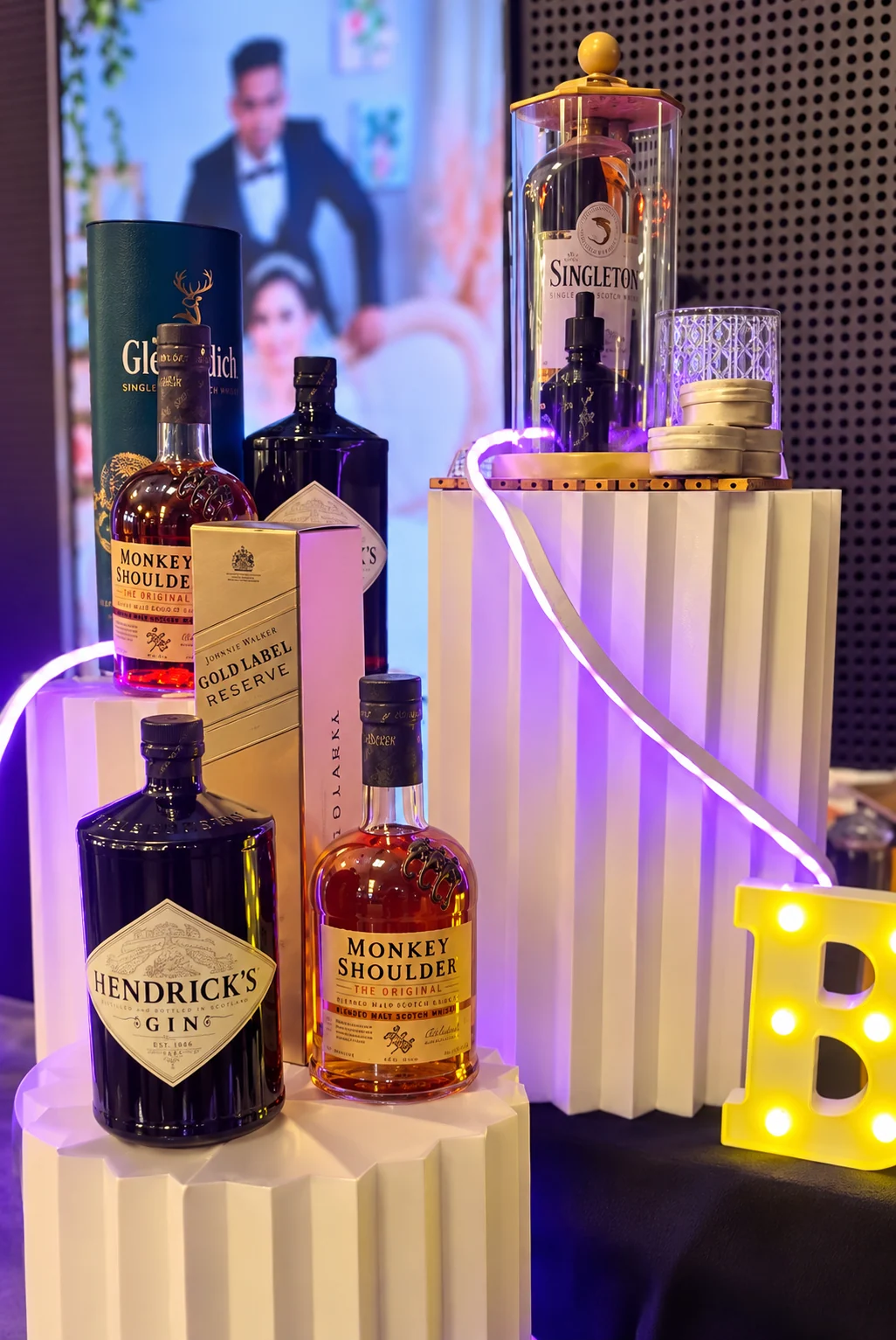 A premium spirits display with illuminated event decor.
