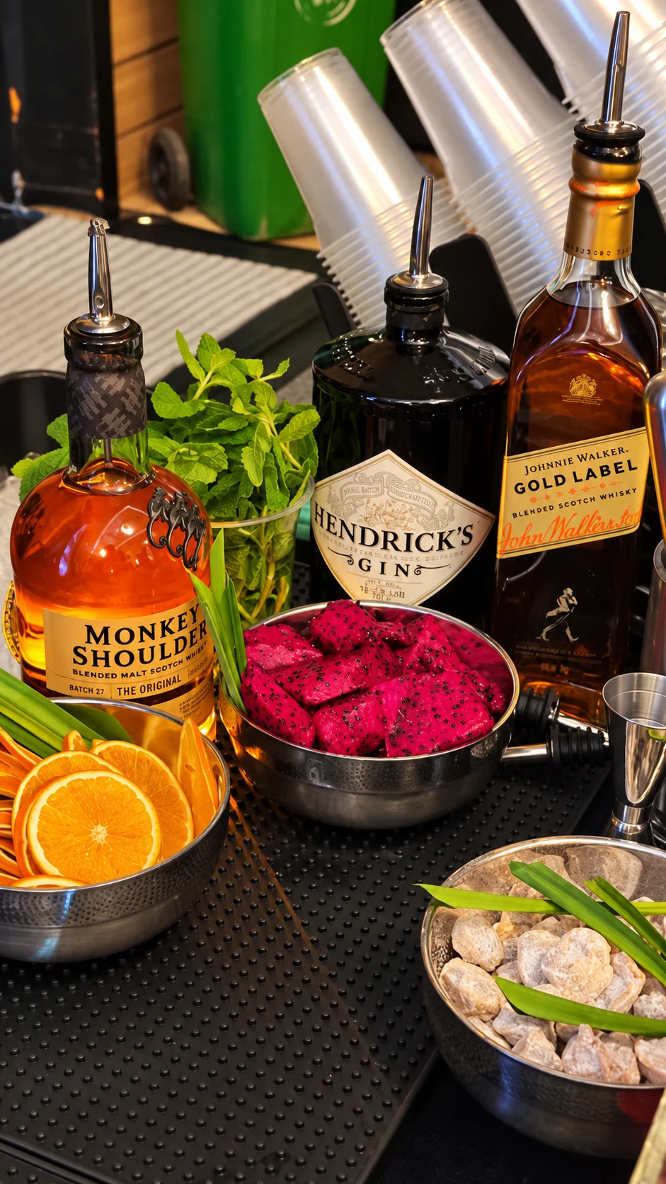 Premium spirits, fresh citrus, mint and dragon fruit prepared at the Vibe N Pour bar.